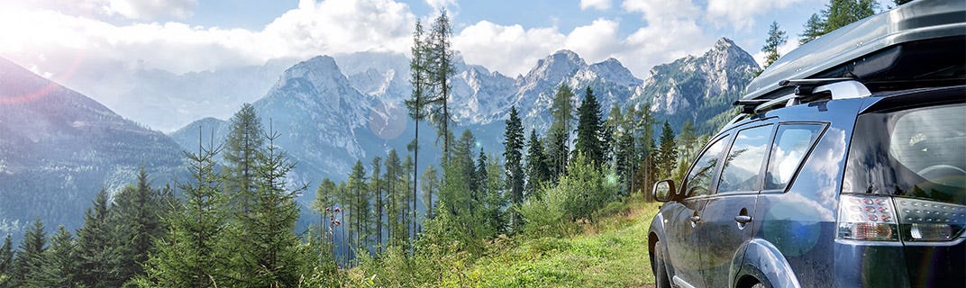 Vehicle overlooking mountains and forestry